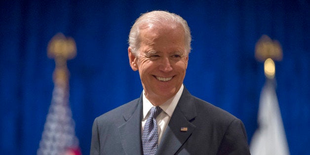 Vice President Joe Biden smiles as he arrives to speak to the University of Notre Dame Leaders Symposium, Tuesday, April 14, 2015, at the Ritz Carlton in Washington. (AP Photo/Molly Riley)