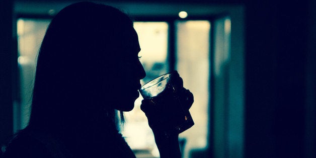 Silhouette of girl who is drinking