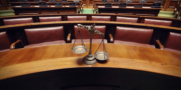 Symbol of law and justice in the empty courtroom, law and justice concept.