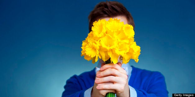 man holding a bouquet of flowers