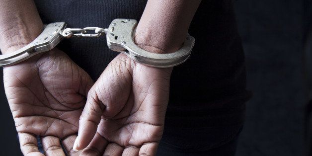 Black woman in handcuffs