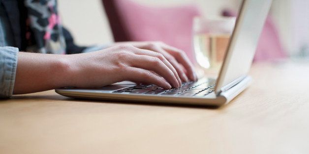 Netherlands, Goirle, Close-up of woman using laptop