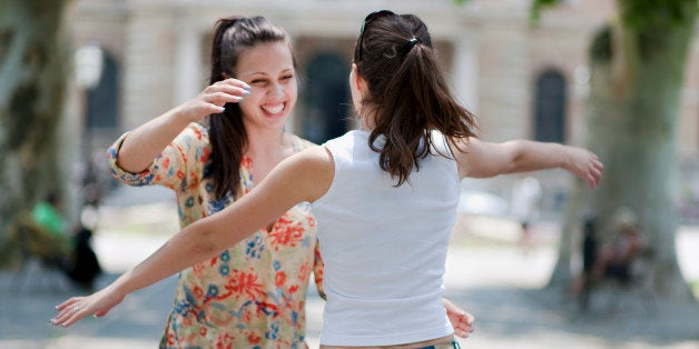 Young women hugging