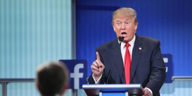 CLEVELAND, OH - AUGUST 06: Republican presidential candidate Donald Trump fields a question during the first Republican presidential debate hosted by Fox News and Facebook at the Quicken Loans Arena on August 6, 2015 in Cleveland, Ohio. The top ten GOP candidates were selected to participate in the debate based on their rank in an average of the five most recent political polls. (Photo by Scott Olson/Getty Images)