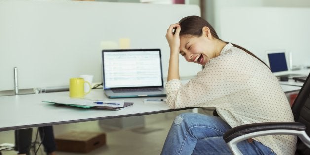 Woman working at laptop in office