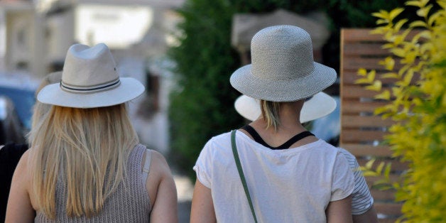 Ladies summer hats on parade in the streets of suburban.