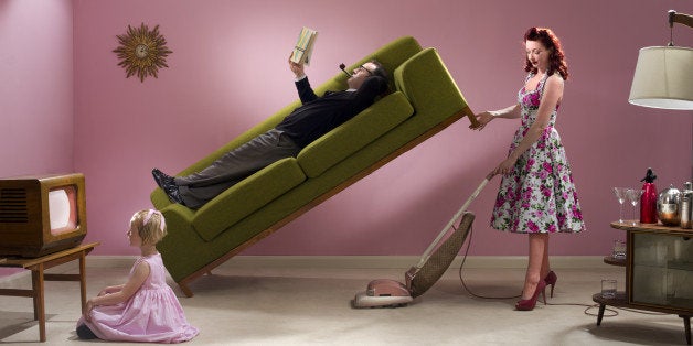 glamorous housewife makes light work of her hoovering
