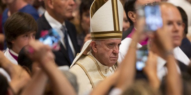 Pope Francis arrives to attend a prayer on the occasion of the World Day of the Creation's care in St. Peter's Basilica at the Vatican, Tuesday, Sept. 1, 2015. Pope Francis declared on Tuesday he is allowing all priests in the church's upcoming Year of Mercy to absolve women of the "sin of abortion" if they repent with a "contrite heart," saying he is acutely aware some feel they no other choice but to abort. (AP Photo/Riccardo De Luca)