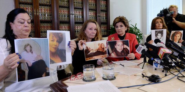 LOS ANGELES, CA - SEPTEMBER 30: Pamela Abeyta, (L) Sharon Van Ert (2nd (L) and Lisa Christie, (R) former Mrs. America,1997-1998, three new alleged sexual assault victims of comedian Bill Cosby, hold their photographs from when they were younger during a news conference with attorney Gloria Allred September 30, 2015, in Los Angeles, California. Cosby has been accused of sexual assault by over 30 women. (Photo by Kevork Djansezian/Getty Images)