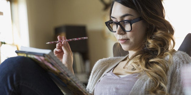 Woman writing in notebook