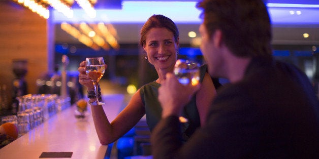 Couple drinking wine in a hotel bar