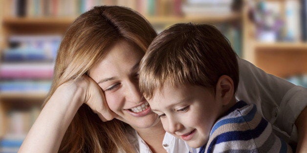 Mother reading Bible stories to her boy