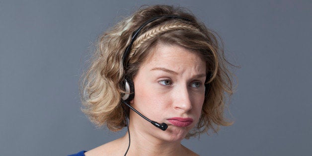 young fed up female professional working for a call center