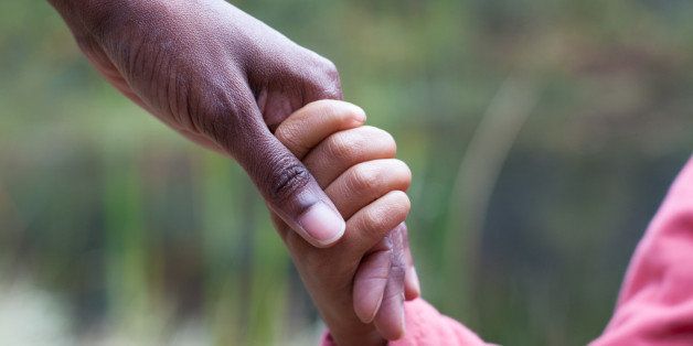 Woman holding young daughter's hand in Northern California