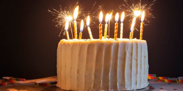 Birthday cake with candles and sparklers.