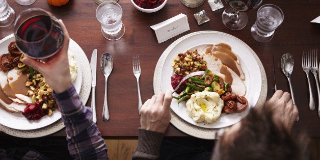 Overhead of two men eating holiday meal