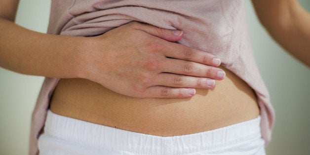 woman with hand on her stomach