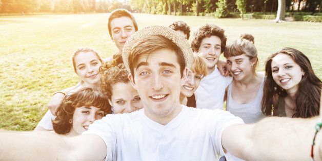 Ten friends do a selfie in the park
