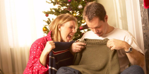 Couple opening christmas gifts