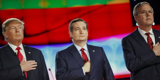 2016 Republican presidential candidates Donald Trump, president and chief executive of Trump Organization Inc., from left, Senator Ted Cruz, a Republican from Texas, and Jeb Bush, former governor of Florida, stand on stage at the start of the Republican presidential candidate debate at The Venetian in Las Vegas, Nevada, U.S., on Tuesday, Dec. 15, 2015. With less than two months remaining before the Feb. 1 Iowa caucuses and the Feb. 9 New Hampshire primary, middle-of-the-pack candidates hoping for a late surge in the polls have little choice but to come out swinging in tonight's fifth Republican debate. Photographer: Patrick T. Fallon/Bloomberg via Getty Images