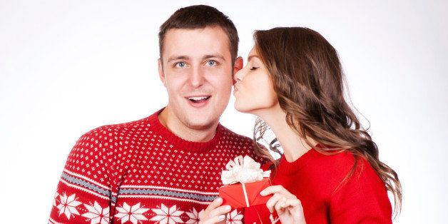 Lovely christmas couple holding presents