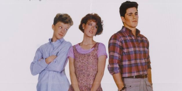 A poster for John Hughes' 1984 romantic comedy 'Sixteen Candles' starring (L-R) Anthony Michael Hall, Molly Ringwald, and Michael Schoeffling. (Photo by Movie Poster Image Art/Getty Images)