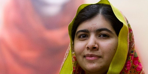 Pakistani activist for female education and Nobel Peace Prize laureate Malala Yousafzai poses for photographers in front of '