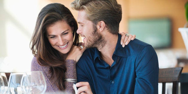 Man with engagement ring proposing his girlfriend in a restaurant