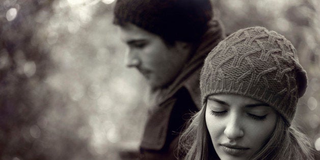 Young couple having relationship difficulties, outdoor shot