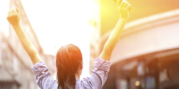 young asian woman open arms on the shopping street