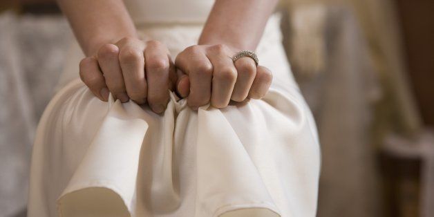 Woman clutching dress