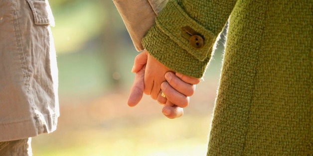 Couple holding hands outdoors