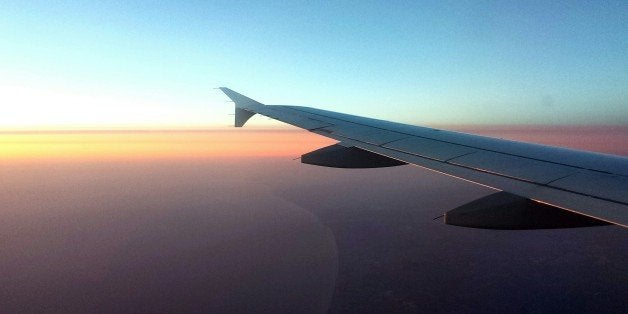 Cropped Image Of Airplane Flying In Sky