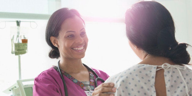 Nurse talking to patient in hospital room