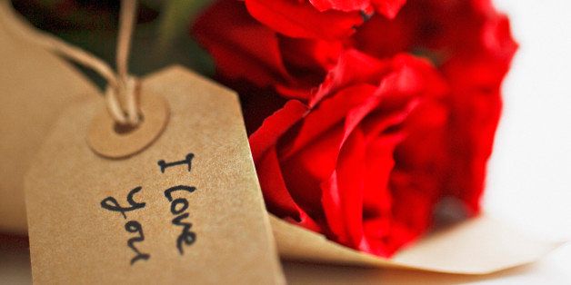 Close up of red roses with gift tag