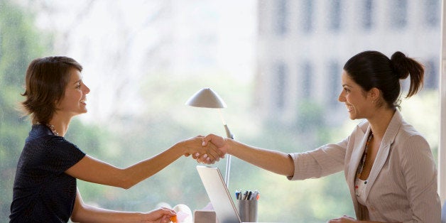 Businesswomen shaking hands