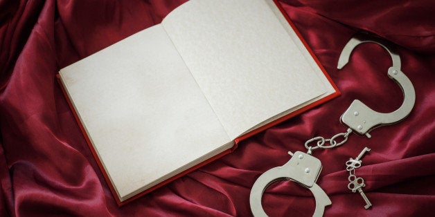Book and handcuffs with keys