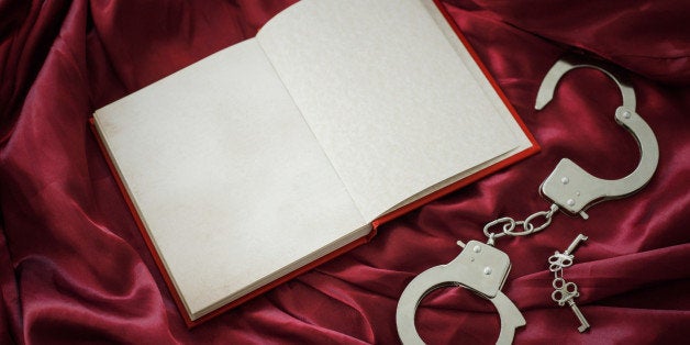 Book and handcuffs with keys 