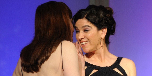 HOLLYWOOD, CA - MARCH 31: Rebecca Louisell (R) accepts the Focus on Diversity and Gender Equality in Children's Media award for 'The Maiden and the Prince' from actor Geena Davis onstage at the Academy of Television Arts & Sciences Foundation Celebrates The 33rd Annual College Television Awards at the Renaissance Hollywood Hotel on March 31, 2012 in Hollywood, California. (Photo by Frank Micelotta/Invision for the Academy of Television Arts & Sciences/AP Images)