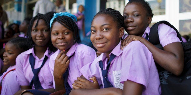 Beira, Mozambique - September 29: Students in school uniforms posing for a photo on September 29, 2015 in Beira, Mozambique. (Photo by Thomas Trutschel/Photothek via Getty Images)