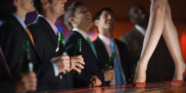 Businessmen at a Strip Club