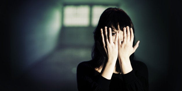 Young female prisoner. The projected image in the background is my own and can be found in my portfolio.