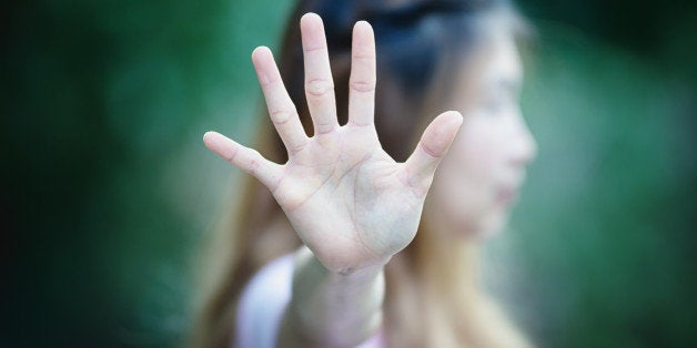 Asian women showing stop hand gesture, focus hand