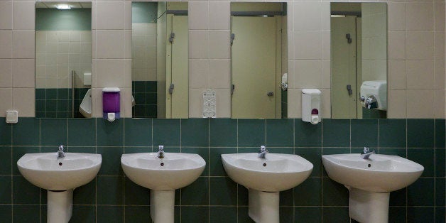 A row of basins in a public toilet