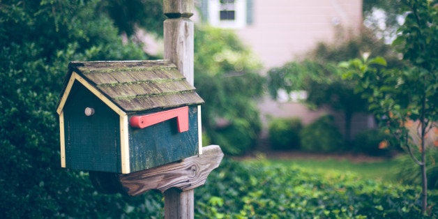 A house shpaed mailbox or postbox