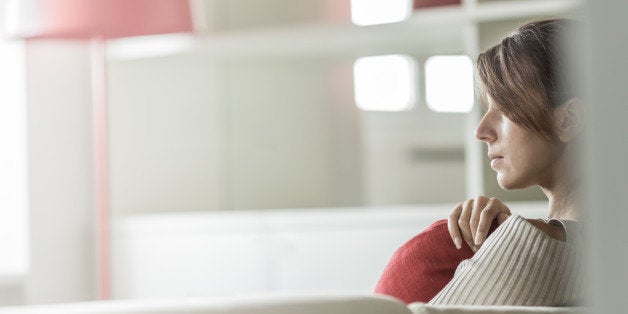 Young woman relaxing on sofa at home