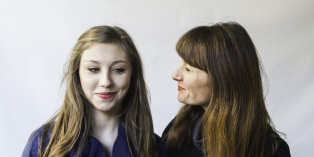 Close shot of mother looking humorously at her teenage daughter.