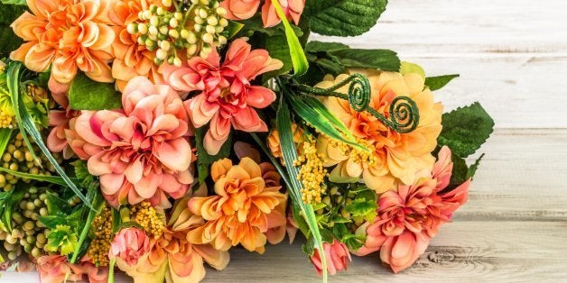 Colorful flowers bouquet on wood background. Flowers backgrounds.