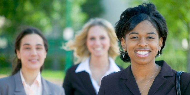 Three businesswomen smiling