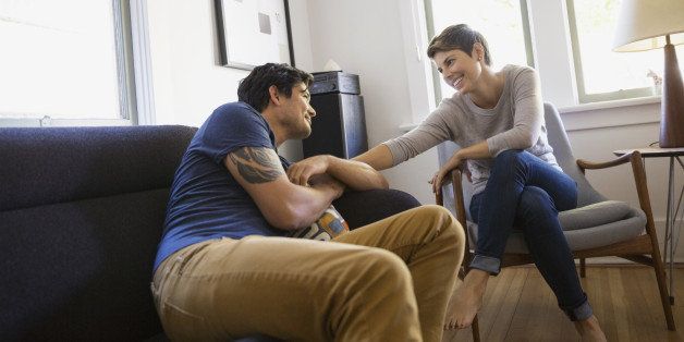 Couple talking in living room